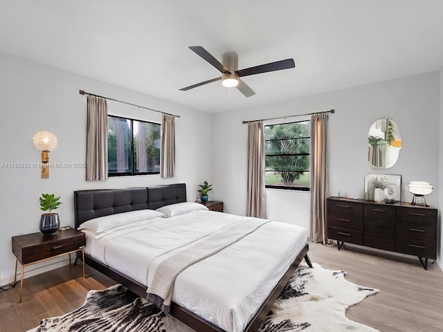 bedroom featuring ceiling fan and light hardwood / wood-style floors