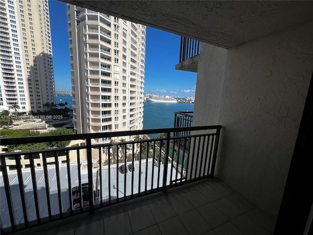 balcony featuring a water view