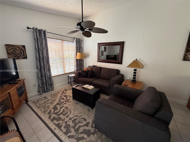609 Waterside Dr Unit 609, Hypoluxo, FL 33462 - living room featuring light tile patterned floors, ceiling fan, and a textured ceiling