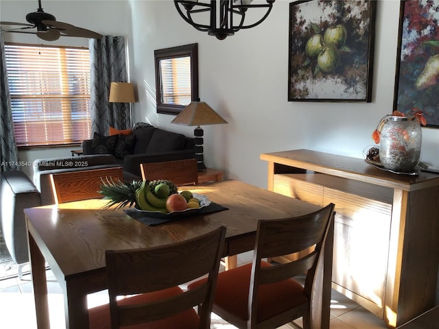 609 Waterside Dr Unit 609, Hypoluxo, FL 33462 - dining area featuring a chandelier and a ceiling fan