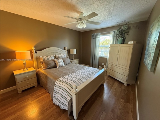 609 Waterside Dr Unit 609, Hypoluxo, FL 33462 - bedroom featuring a textured ceiling, wood finished floors, and a ceiling fan