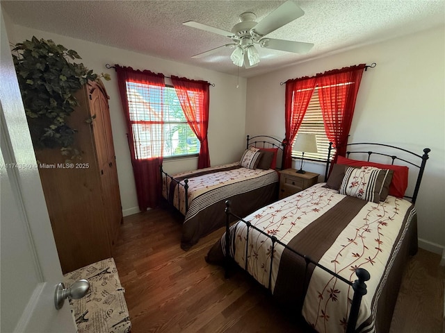 609 Waterside Dr Unit 609, Hypoluxo, FL 33462 - bedroom featuring multiple windows, wood finished floors, a textured ceiling, and ceiling fan