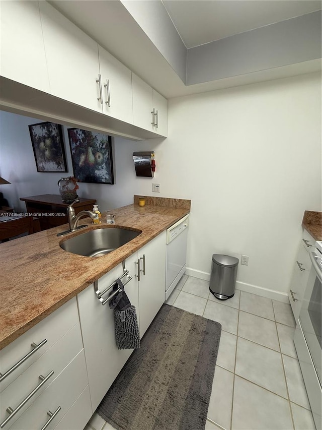 609 Waterside Dr Unit 609, Hypoluxo, FL 33462 - kitchen with dishwasher, light tile patterned floors, white cabinets, and range