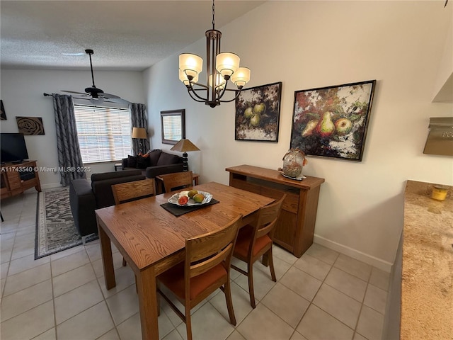 609 Waterside Dr Unit 609, Hypoluxo, FL 33462 - dining area featuring light tile patterned floors, vaulted ceiling, a chandelier, and a textured ceiling