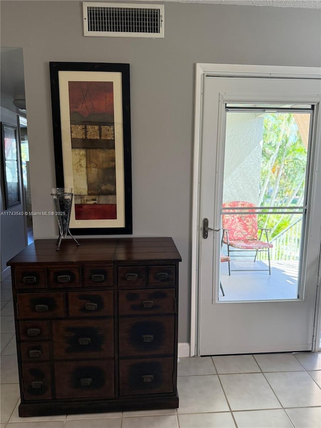 609 Waterside Dr Unit 609, Hypoluxo, FL 33462 - doorway to outside featuring light tile patterned flooring