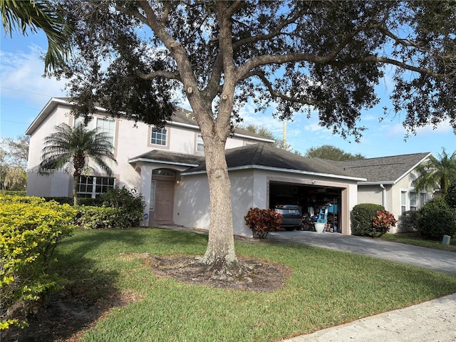 view of front of home featuring a garage and a front yard