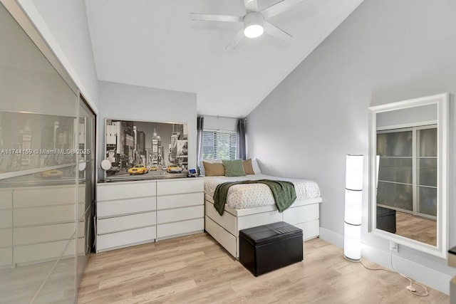 bedroom with ceiling fan, vaulted ceiling, and light wood-type flooring