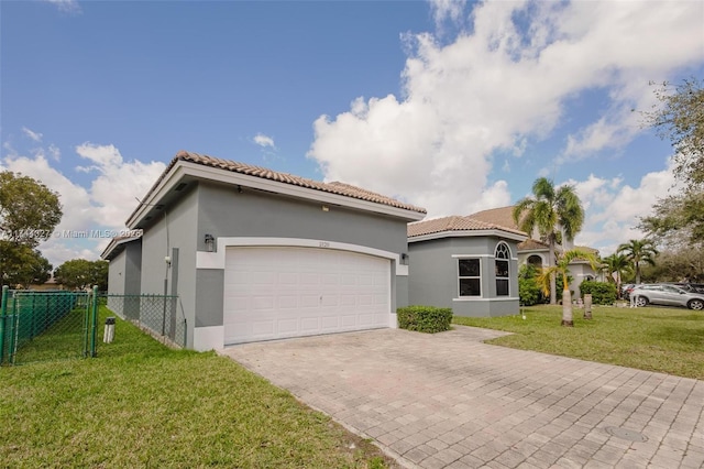 2120 SE 17th Ave, Homestead, FL 33035 - mediterranean / spanish-style home featuring stucco siding, an attached garage, decorative driveway, and a tile roof
