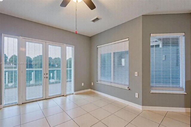 2120 SE 17th Ave, Homestead, FL 33035 - empty room with a ceiling fan and light tile patterned floors