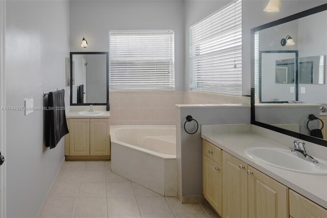 2120 SE 17th Ave, Homestead, FL 33035 - bathroom with a garden tub, tile patterned flooring, and two vanities