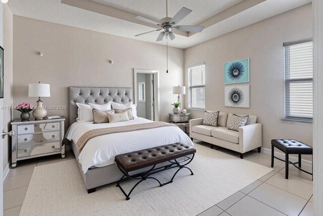 2120 SE 17th Ave, Homestead, FL 33035 - bedroom with light tile patterned floors and a tray ceiling