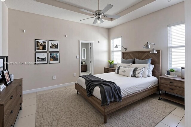 2120 SE 17th Ave, Homestead, FL 33035 - bedroom featuring light tile patterned floors and a raised ceiling