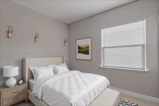 2120 SE 17th Ave, Homestead, FL 33035 - bedroom with baseboards and tile patterned floors