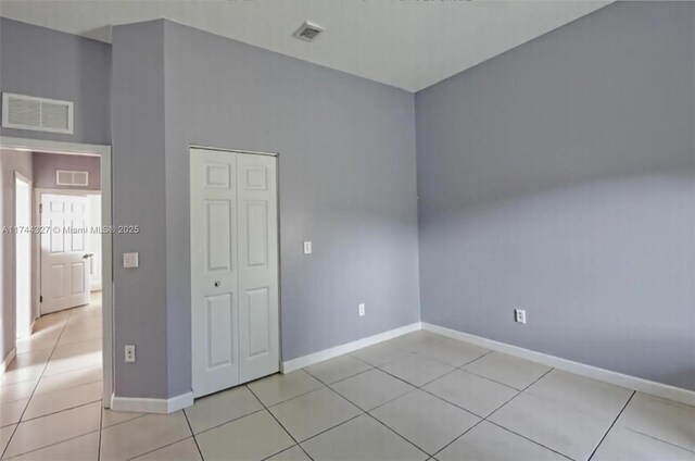 2120 SE 17th Ave, Homestead, FL 33035 - spare room with baseboards and light tile patterned floors