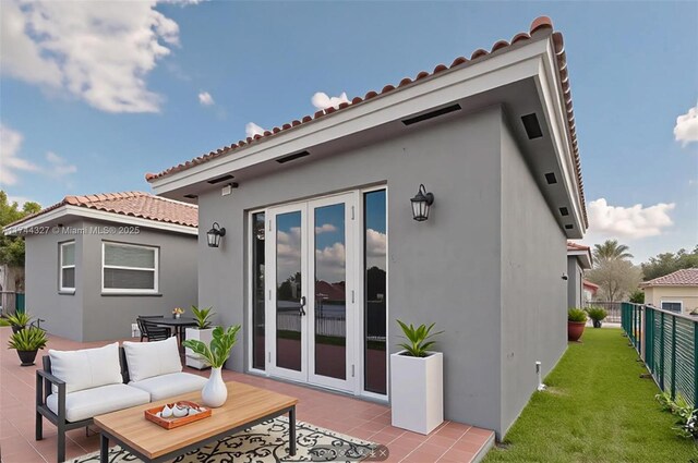 2120 SE 17th Ave, Homestead, FL 33035 - rear view of property with a patio area, a tiled roof, stucco siding, and outdoor lounge area