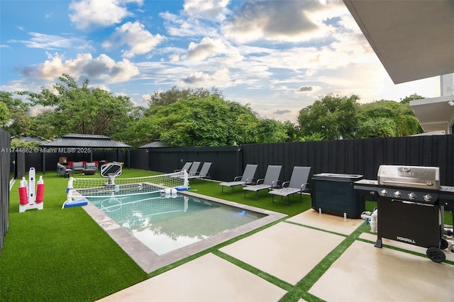 view of swimming pool featuring grilling area, a yard, outdoor lounge area, and a patio area