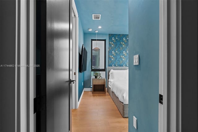 bedroom featuring light hardwood / wood-style flooring