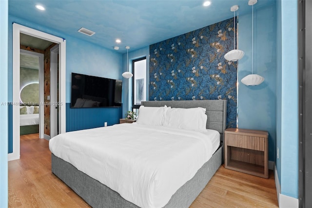 bedroom with wood-type flooring