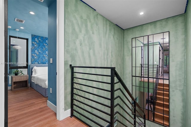 hallway with wood-type flooring