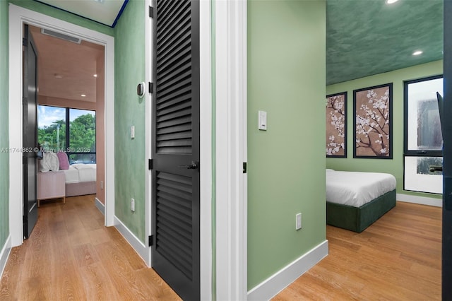 corridor featuring light hardwood / wood-style floors