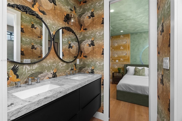 bathroom featuring vanity and wood-type flooring