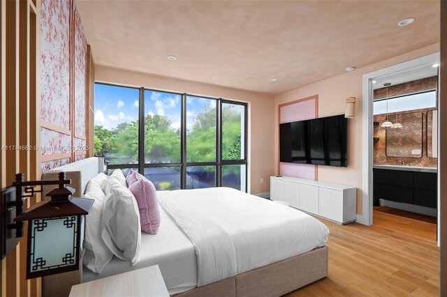 bedroom with light wood-type flooring