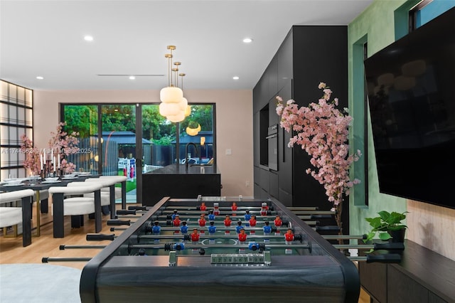 game room featuring light hardwood / wood-style flooring