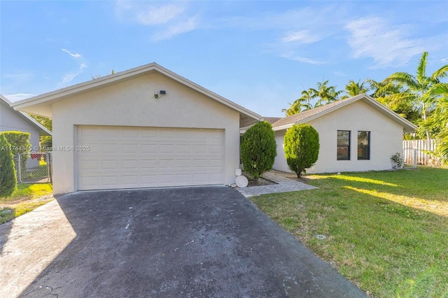 ranch-style home with a garage and a front yard