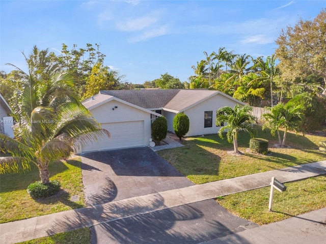 ranch-style house with a garage and a front yard