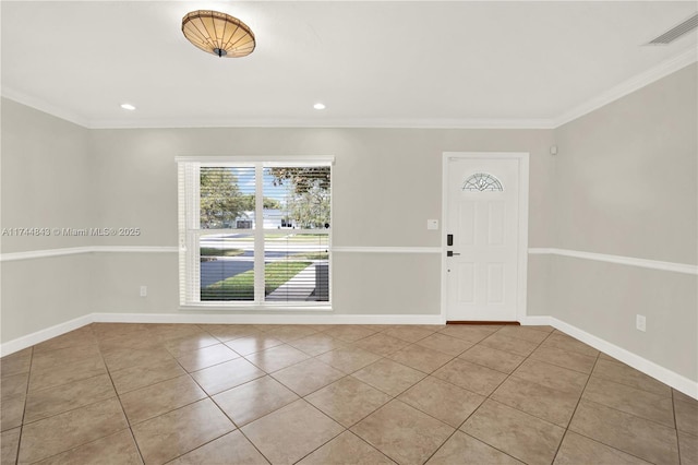 tiled foyer entrance with baseboards, visible vents, crown molding, and recessed lighting