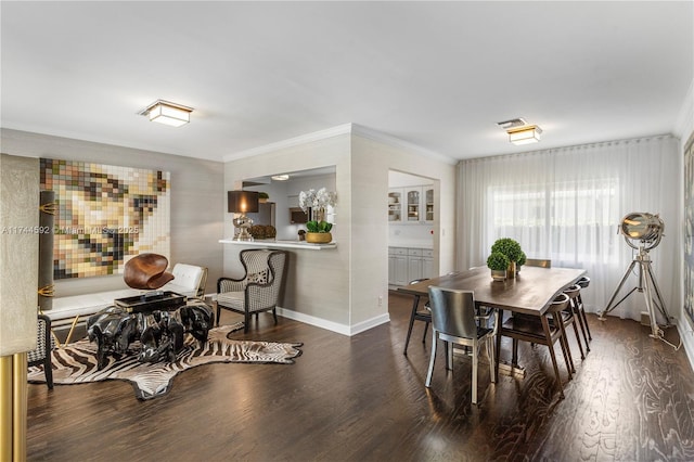 dining room with dark wood-type flooring and ornamental molding