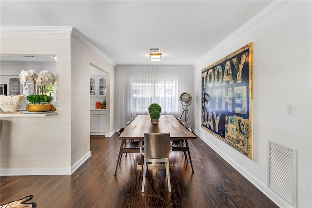 dining area with ornamental molding and dark wood-type flooring