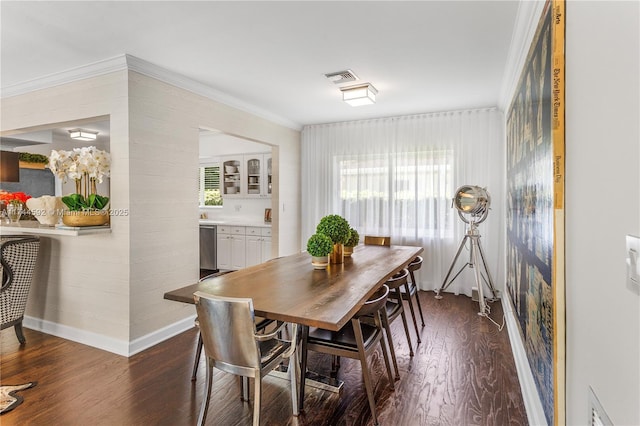 dining area with dark wood finished floors, baseboards, visible vents, and ornamental molding
