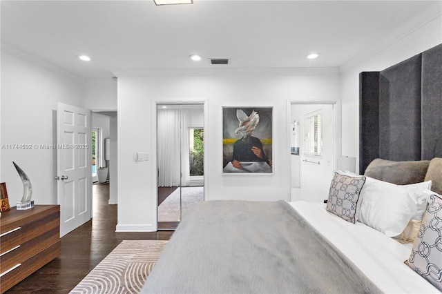 bedroom featuring crown molding and dark hardwood / wood-style floors