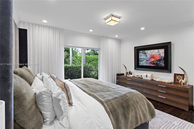 bedroom with wood finished floors and recessed lighting