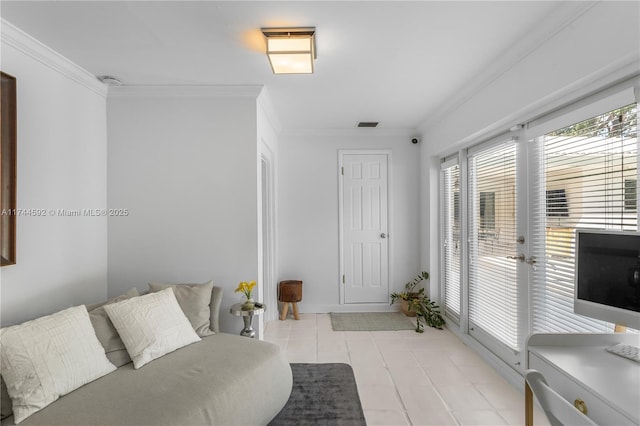 living area with visible vents and crown molding