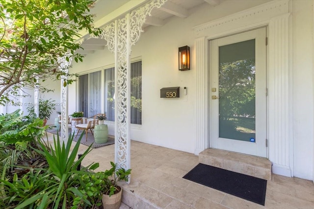 doorway to property with a porch