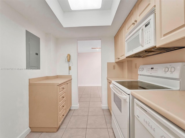 kitchen with light tile patterned flooring, white appliances, electric panel, and a raised ceiling