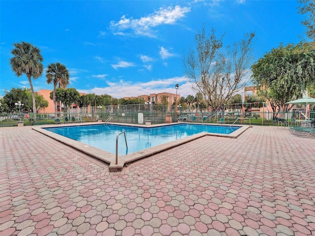 view of swimming pool featuring a patio area