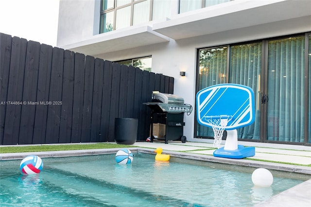 view of swimming pool with area for grilling