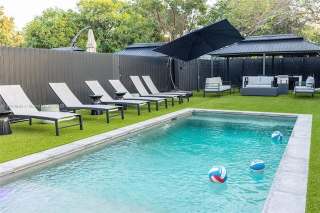 view of pool featuring a gazebo, an outdoor hangout area, and a lawn