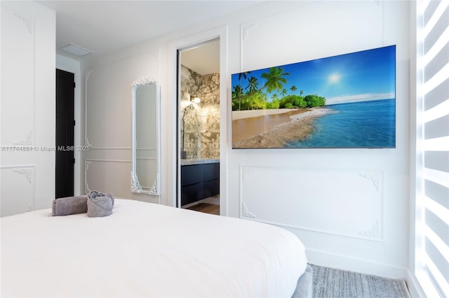 bedroom featuring connected bathroom