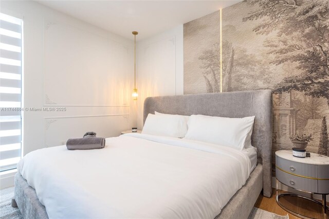 bedroom featuring wood-type flooring