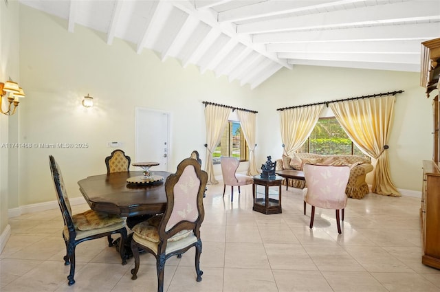 2061 NE 207th St, Miami, FL 33179 - dining space featuring beam ceiling, light tile patterned floors, baseboards, and high vaulted ceiling