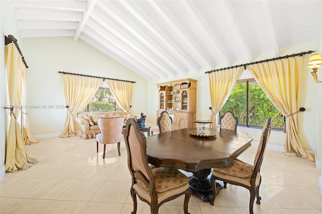 2061 NE 207th St, Miami, FL 33179 - dining room featuring light tile patterned floors, healthy amount of natural light, and baseboards