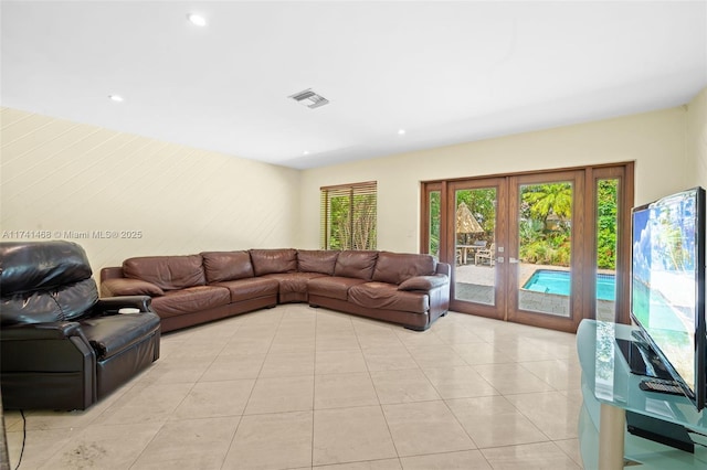 2061 NE 207th St, Miami, FL 33179 - living room with french doors, light tile patterned floors, and recessed lighting