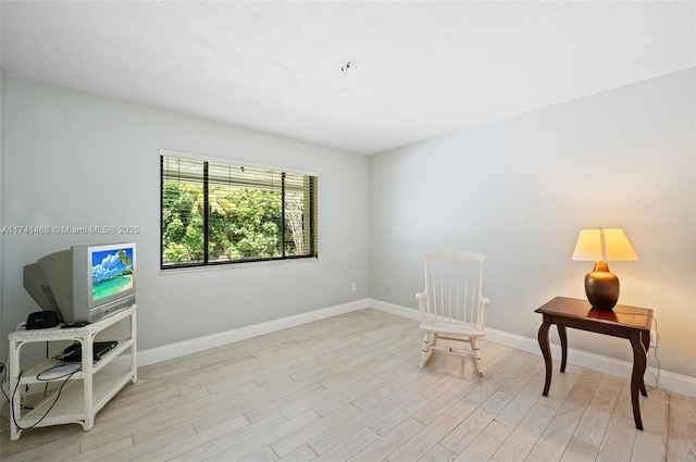 2061 NE 207th St, Miami, FL 33179 - sitting room with light wood-style flooring and baseboards