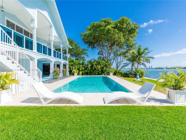 1080 NE Little River Dr, Miami, FL 33138 - view of pool with a yard, a patio area, and a water view