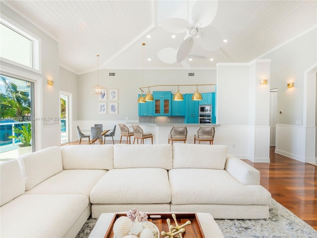 living room featuring lofted ceiling, wood ceiling, ceiling fan, hardwood / wood-style floors, and ornamental molding