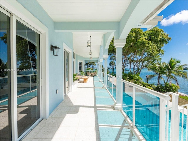 view of pool with a water view